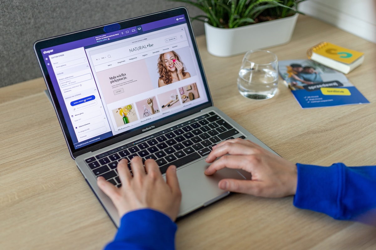 Person creating product listing on laptop