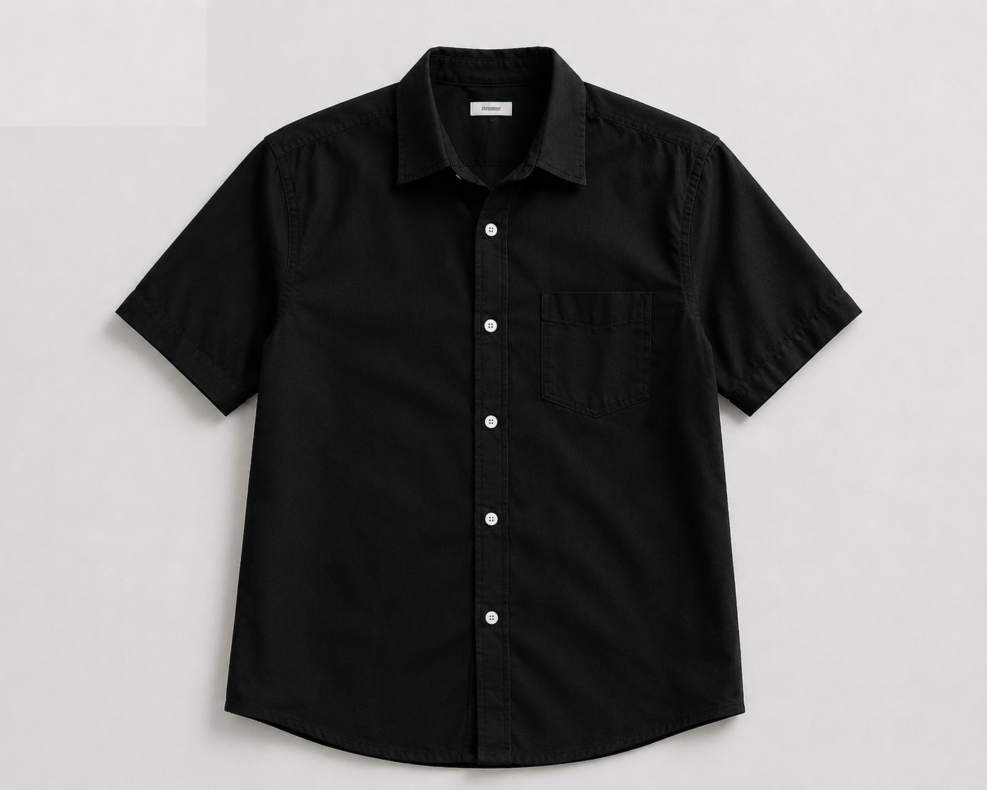 Flat black short-sleeve shirt photo uploaded to CatalogX AI virtual try-on